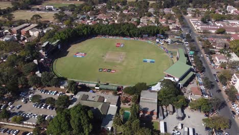 Drone-video-of-a-cricket-match-between-Zimbabwe-and-Sri-Lanka-at-Queens-Sports-Club-in-Bulawayo,-Zimbabwe