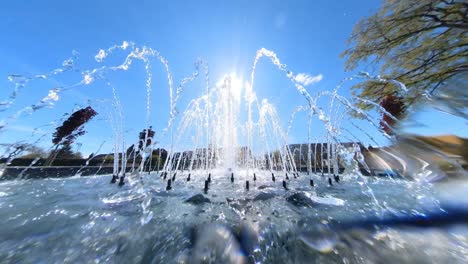 Slow-Motion-Shot-of-City-Fountain-on-a-Sunny-Day
