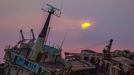 Sun-rising-through-clouds-over-Edro-III-Shipwreck-in-Cyprus