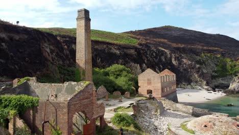 Cinematic-aerial-shot-flying-by-the-remains-of-the-Porth-Wen-Brickworks-in-Anglesey,-North-Wales,-Europe