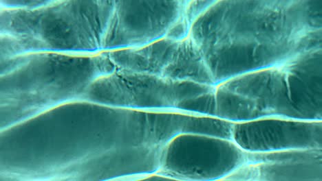 Turquoise-ripples-glistening-in-refreshing-swimming-pool