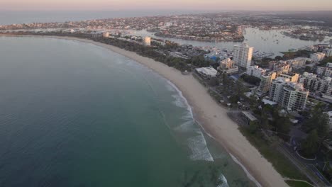 Calm-Waves-Splashing-the-Shore-in-Rock-Wall-Point-Cartwright,-Mooloolaba,-Sunshine-Coast,-Queensland,-Australia,-Aerial-Shot