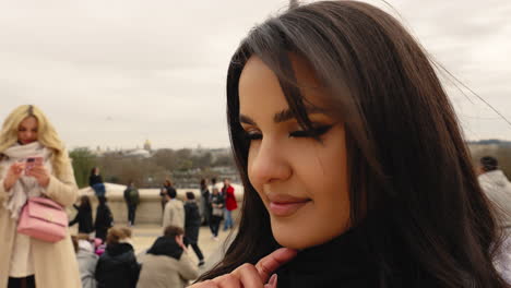 Female-Tourist-At-Daytime-In-Paris,-France-With-Iconic-Eiffel-Tower-In-Backdrop