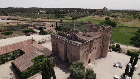 Orbit-aerial-of-Castle-of-Arguijuelas-de-Abajo,-Fortress-in-Cáceres,-Spain