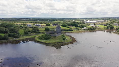 Aerial-Rising-Shot-of-Historic-Dunguaire-Castle-in-County-Galway,-Ireland