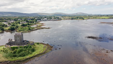 Aerial-Shot-of-Historic-Dunguaire-Castle-and-Galway-Bay-in-County-Galway,-Ireland