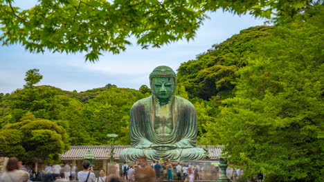 moving-Timelapse-zoom-in-Great-buddha-of-Kamakura-bronze-Daibutsu-Japan-Green-leaves-full-of-tourist
