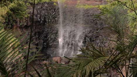 Hand-held-footage-of-the-base-of-Purlingbrook-Falls,-Springbrook-National-Park,-Gold-Coast-Hinterland,-Queensland,-Australia