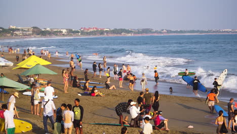 Crowded-Canggu-beach-on-sunny-day,-overtourism-concept