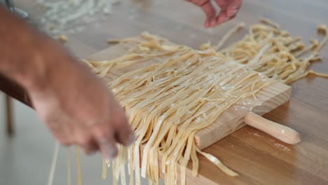 Chef-Sorting-Tagliatelle-in-Slow-Motion---Flouring-Each-Strand---4K-Cinematic