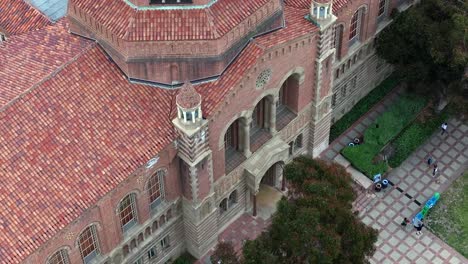UCLA-Powell-Library-building-facade,-zoomed-in-rising-aerial-shot