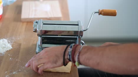 Art-of-Tagliatelle:-Close-Up-of-Unrecognizable-Man-Mastering-Homemade-Pasta---Slow-Motion