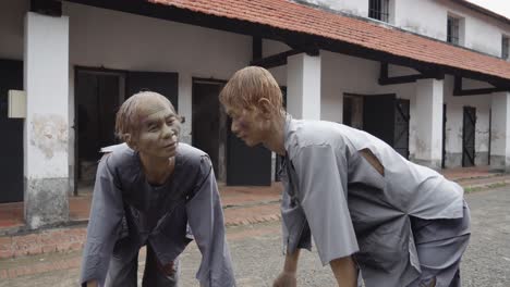 Two-Men-Sculptures-Outside-The-Con-Dao-Prison-In-Vietnam