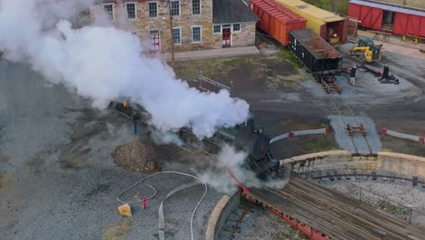 A-Drone-View-of-a-Restored-Steam-Engine-on-a-Roundtable-Blowing-Smoke-Getting-Ready-for-a-Days-Work