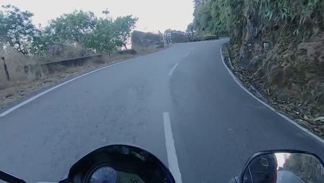 motorcycle-rider-view-of-different-mountain-curvy-road-landscape-at-day-video-is-taken-at-dawki-meghalaya-north-east-india-on-July-06-2023