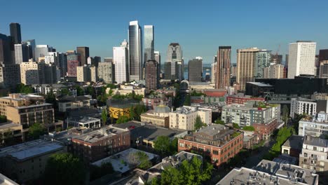 Drone-shot-of-Seattle's-First-Hill-neighborhood-withe-the-city's-skyscrapers-looming-in-the-distance