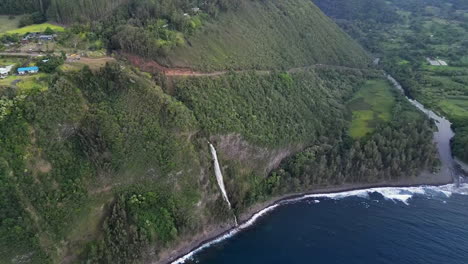 Kaluahine-falls-flowing-into-the-sea-in-big-island,-Hawaii
