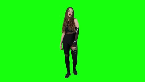 Slow-motion-full-body-view-on-an-attractive-female-model-wearing-a-body-outfit-whistling-in-front-of-a-green-screen