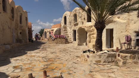 Walking-through-Ksar-Hadada-picturesque-village-in-Tunisia,-location-for-Star-Wars-movie-set-location
