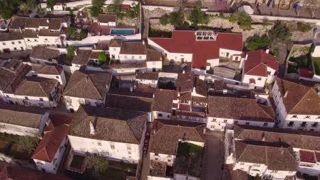 Top-down-of-old-center-of-Obidos-Portugal-with-no-people-in-the-morning,-aerial