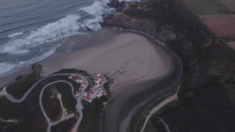 Praia-de-Odeceixe-Portugal-with-no-people-during-sunrise,-aerial