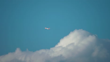 A-passenger-plane-taking-off-appears-out-of-the-thick-white-clouds