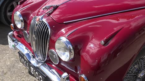 Elegant-lines-of-a-classic-Jaguar-on-display-at-a-vintage-rally-in-Waterford-Ireland-on-a-bright-spring-day