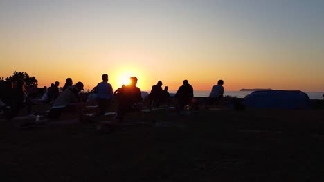 Sunset-yoga-training-for-a-group-of-people