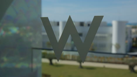 W-Algarve-Hotel-Sign-At-The-Glass-Window-Of-Luxury-Accommodation-In-Algarve-Portugal