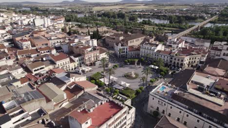Plaza-de-Espana-in-Merida,-Spain,-aerial-around-historical-landmark-and-skyline