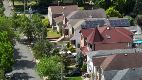 Aerial-zoom-shot-showing-beautiful-american-avenue-with-houses-during-sunny-day-in-Staten-Island-,NYC