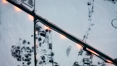 Aerial-over-a-wintry-urban-landscape-near-Voss,-Norway