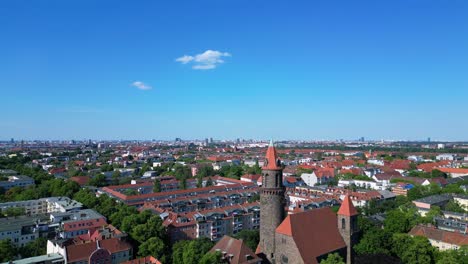 Great-aerial-top-view-flight-Lukas-church-city-Berlin-steglitz,-Germany-Summer-day-2023