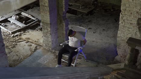 Adult-male-captured-in-an-abandoned-building-while-being-taped-to-the-chair