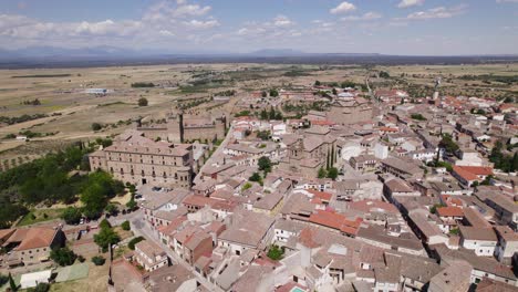 Establishing-aerial-view-of-Oropesa,-Small-Spanish-town-neighbourhood-buildings-in-the-Toledo-province