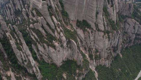 Steep-mountain-cliffs-of-Montserrat-Natural-Park,-aerial