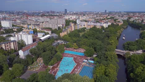Gorgeous-aerial-top-view-flight-public-swimming-pool-Prinzenbad,-city-Berlin-Germany-Summer-day-2023