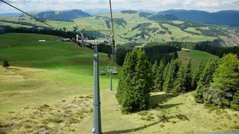 Chairlift-in-the-Alpe-di-Suisi-mountains-in-South-Tyrol,-Italy,-idyllic-alpine-landscape