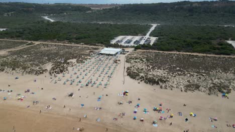 Drone-Aerial-View-Costa-da-Caparica-beach-bar-in-Portugal