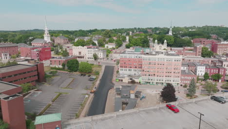 Aerial-View-Over-Lush-Bangor,-Maine,-Highlighting-Downtown,-Church,-and-Garage