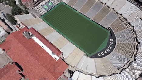 Boulder-CO-USA,-Birds-Eye-Aerial-View-of-Folsom-Field-Stadium,-University-of-Colorado-Campus,-Empty-Stands-and-Green-Grass