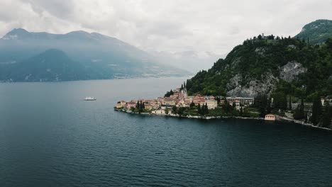 Drone-shot-pulling-away-from-Varenna,-Italy-on-the-shore-of-Lake-Como