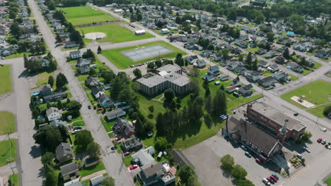 Aerial-Shot-Captures-the-School-and-Surrounding-Fields-in-Madawaska,-Maine