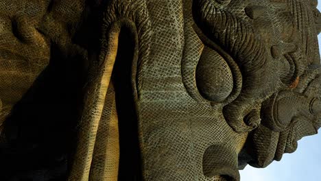 Vertical-Close-up-dolly-forward-shot-of-the-stone-Garuda-bird-statue-at-the-GWK-Cultural-Park-in-Bali-showing-the-texture-a-detail