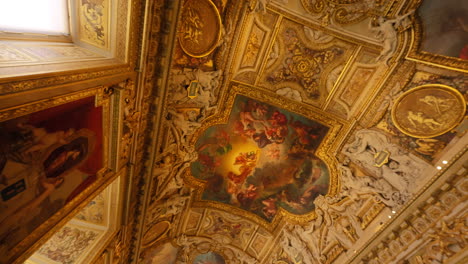 Beautiful-ceiling-decorated-with-paintings-and-rich-art,-in-the-Louvre-Museum,-France