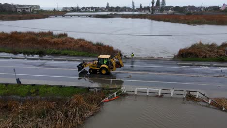 Aerial-view-of-a-tractor-on-a-flooded-highway