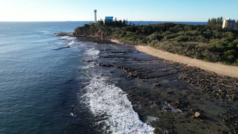 Flying-towards-Point-Cartwright-Lighthouse,-Queensland,-Australia-Aerial-Drone-Shot