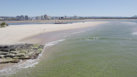 Small-Waves-Splashing-on-the-Shores-of-Maroochydore-Beach,-Queensland,-Australia-Aerial-Drone-Shot