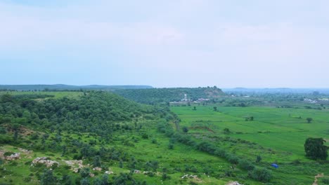 Aerial-Drone-view-of-a-rural-village-of-India-covered-with-lush-green-Jungle-in-Gwalior-Madhya-Pradesh-India