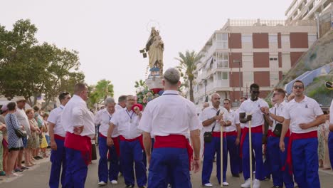 Fishermen-raising-the-paso-in-the-procession-with-the-Virgen-del-Carmen-in-Villajoyosa,-Alicante,-Spain,-2023